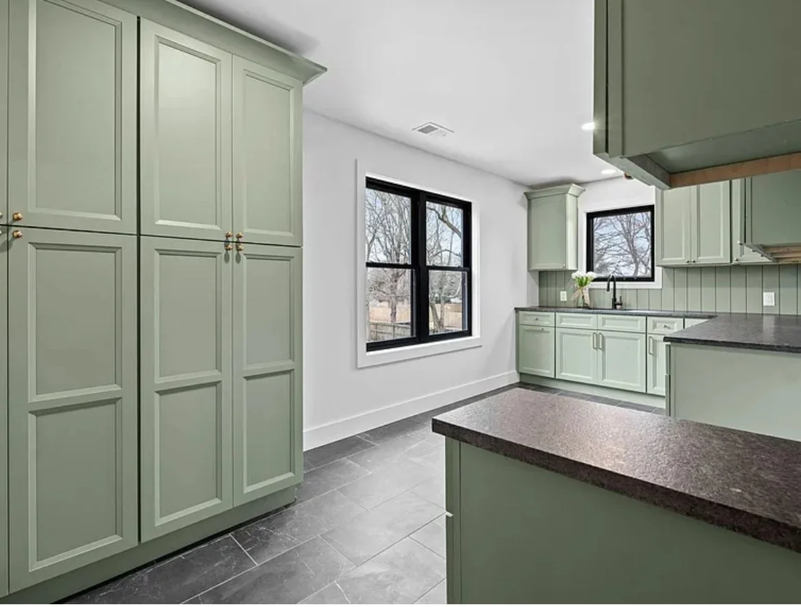 Kitchen with sage green cabinetry