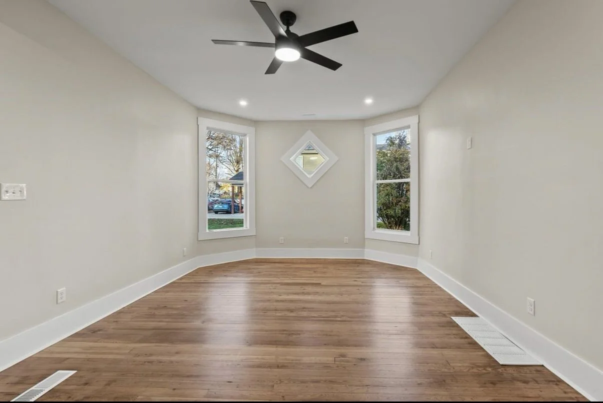 Renovated bedroom with hardwood floors