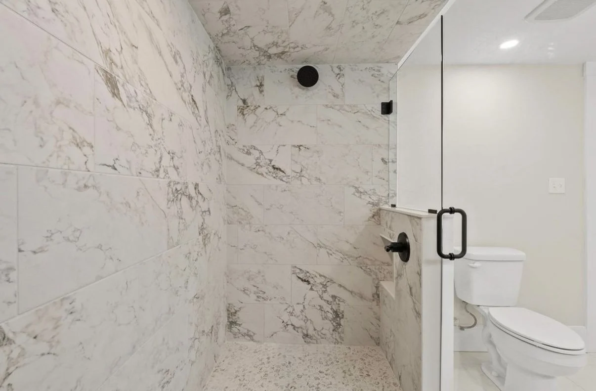 Marble-look tiled walk-in shower