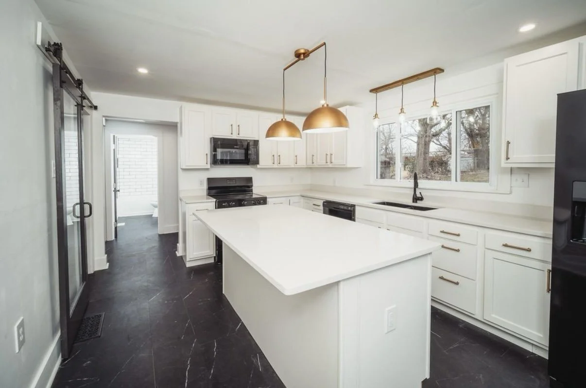 Kitchen remodel with white cabinetry and large island