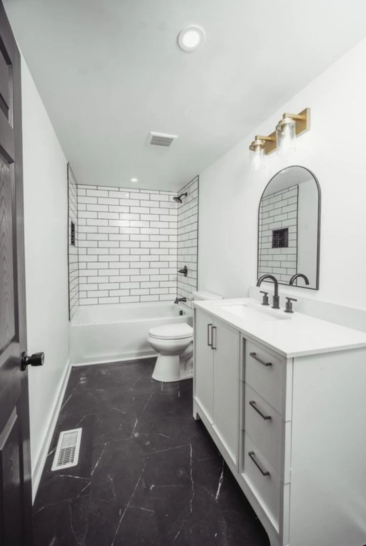 Bathroom with subway tile tub surround