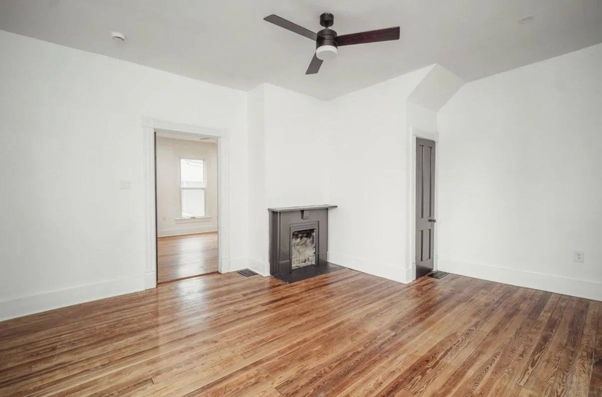 Room with fireplace and hardwood floors