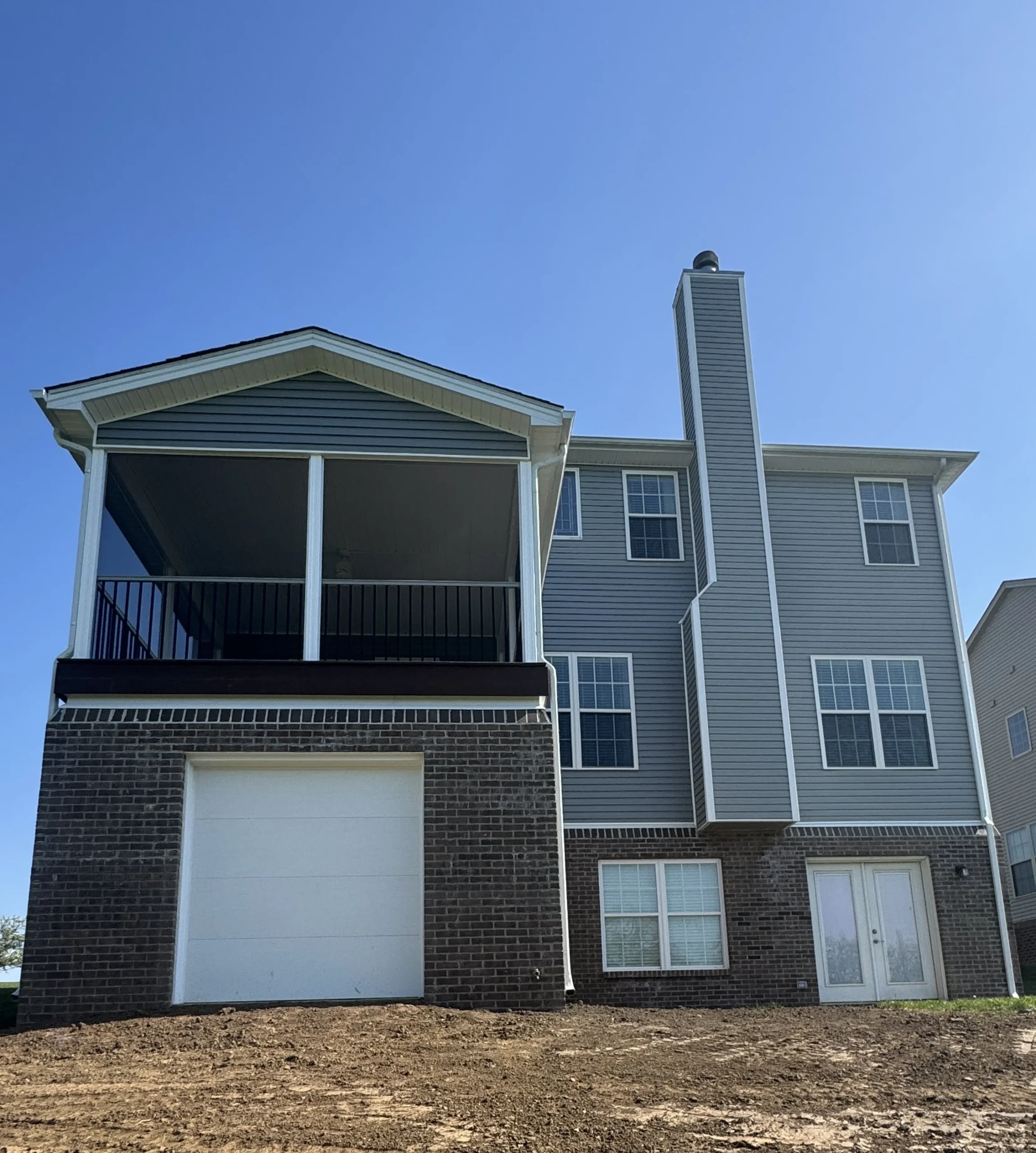 Home exterior with new screened porch addition